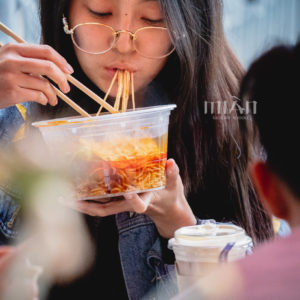 Girl eating noodles